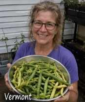 Sarah from Vermont holding freshly harvested green beans